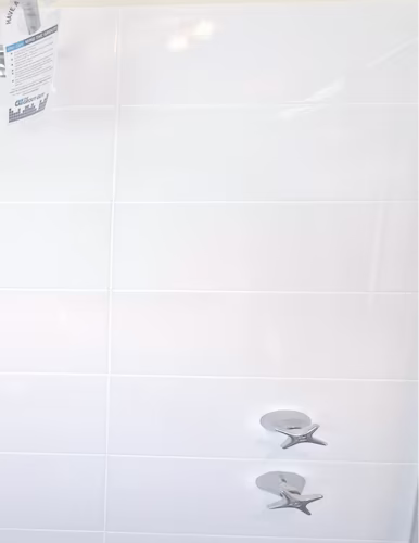 Shower wall with taps after regrouting